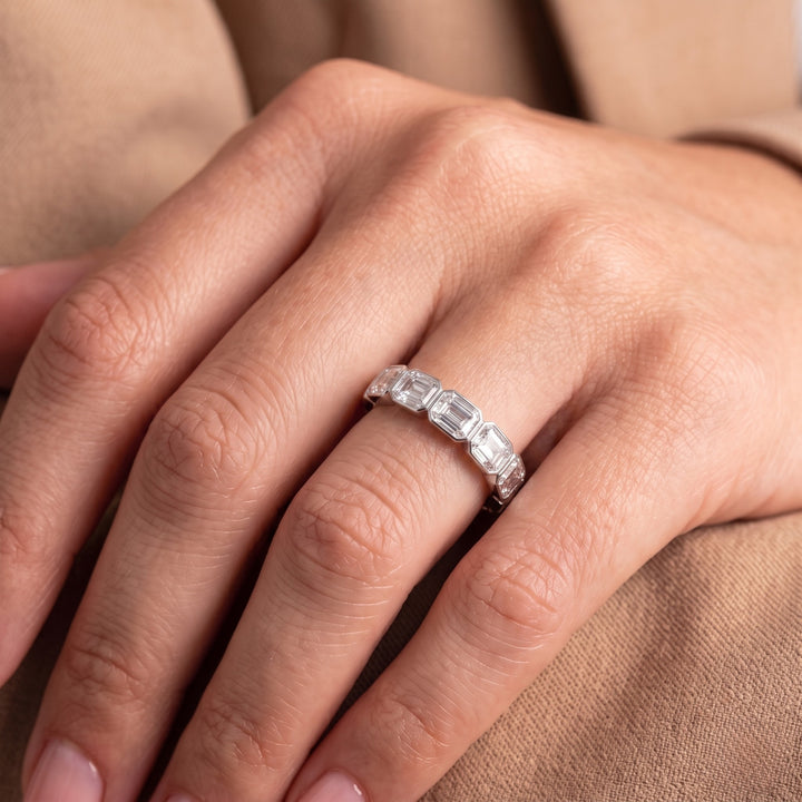 Half eternity band with emerald cut diamond band.
