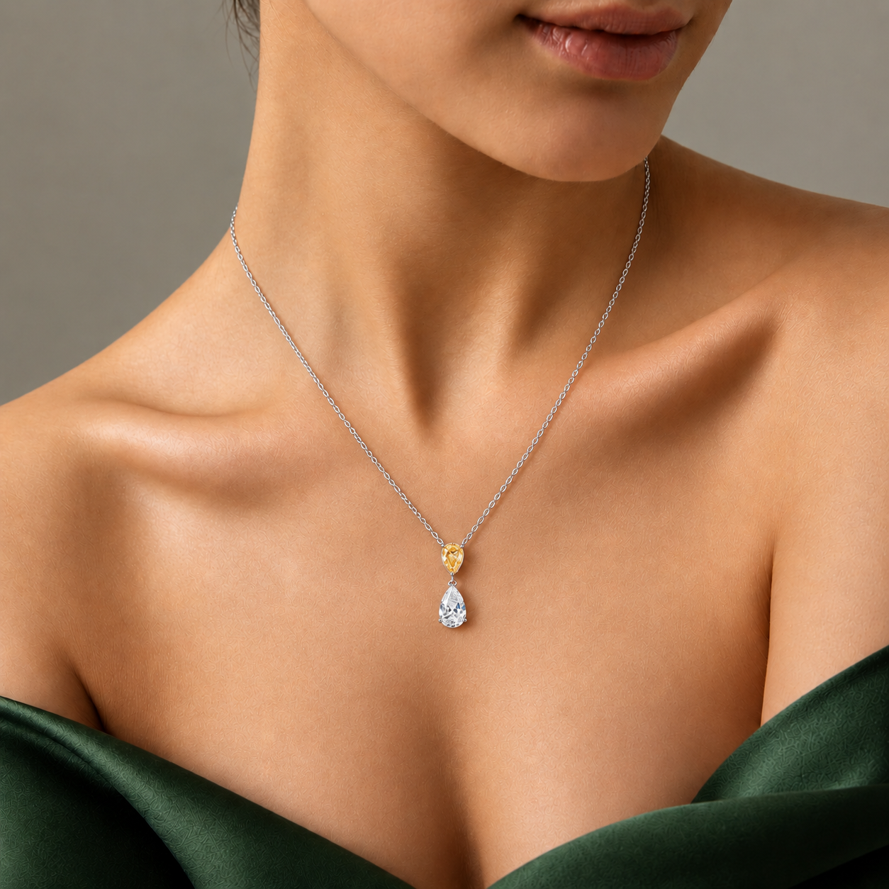 teardrop diamond dangle necklace with two tone gold.
