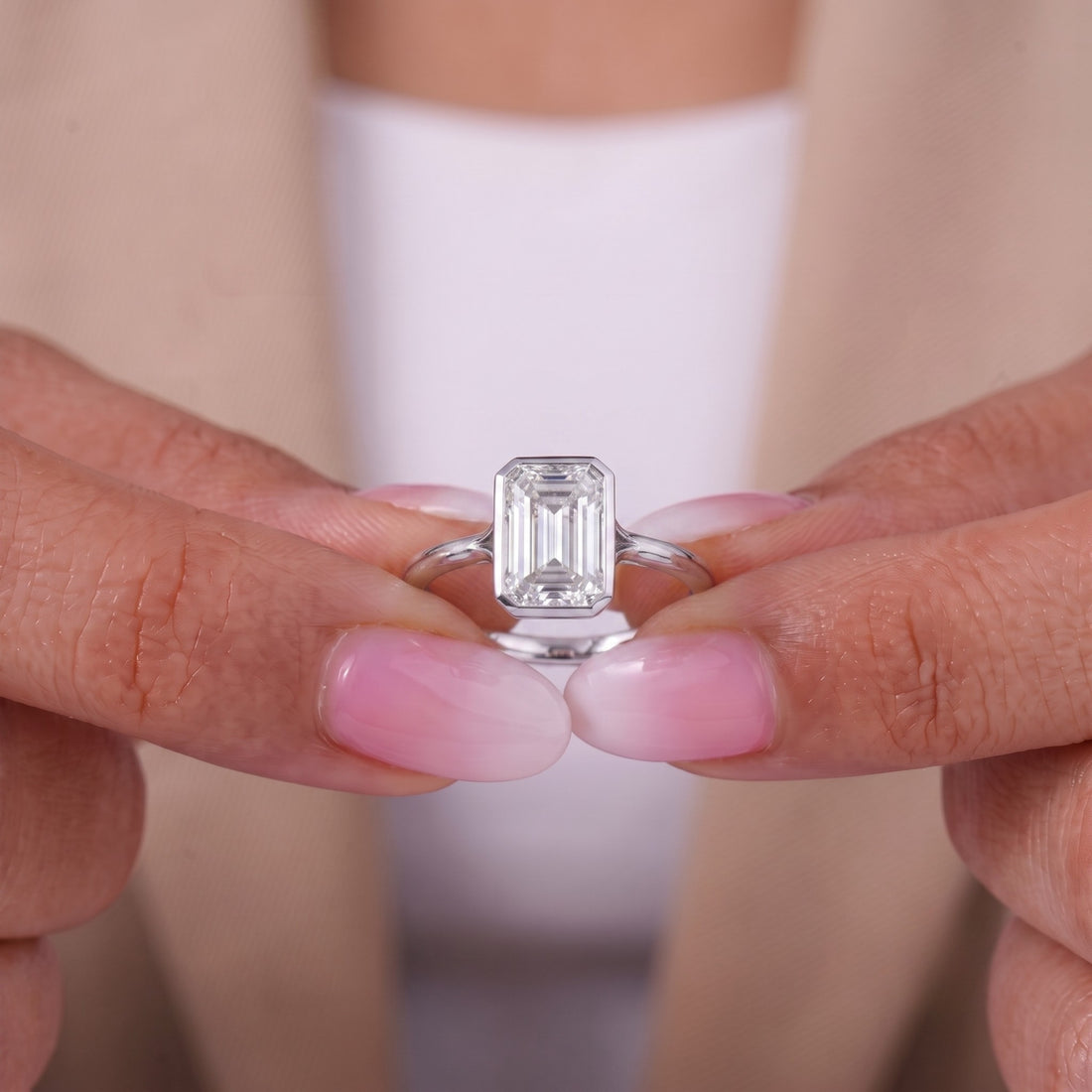 Emerald diamond solitaire ring with solitaire ring.
