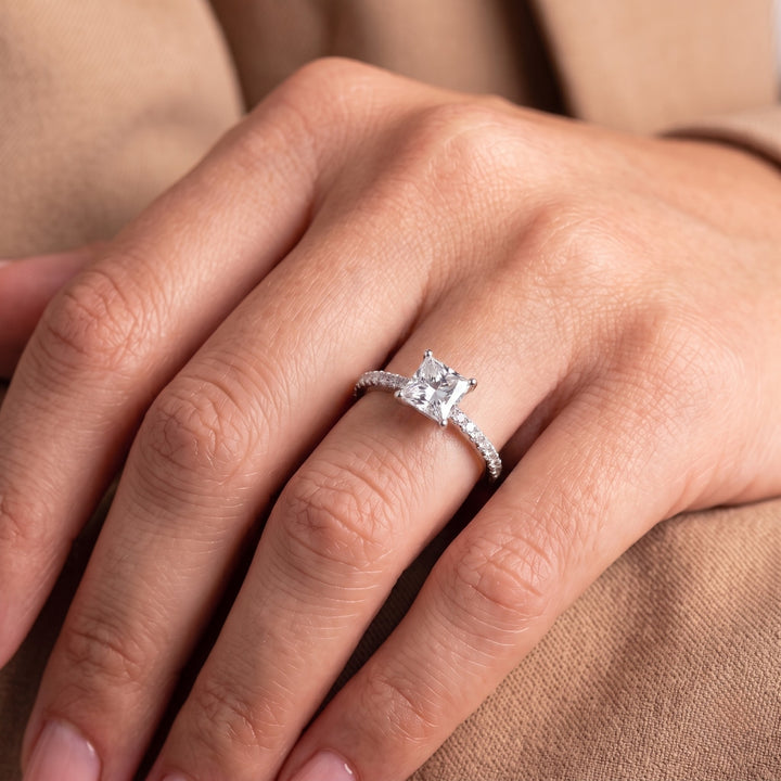 Princess diamond engagement ring with square diamond ring.
