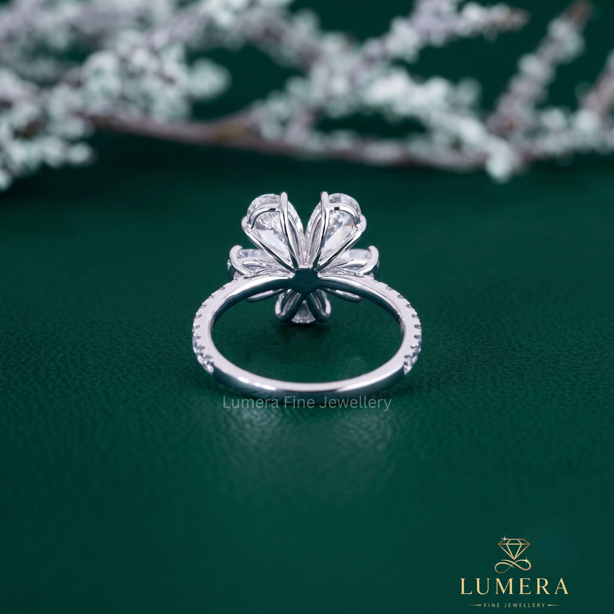 flower shape ring with pear shaped diamond ring.

