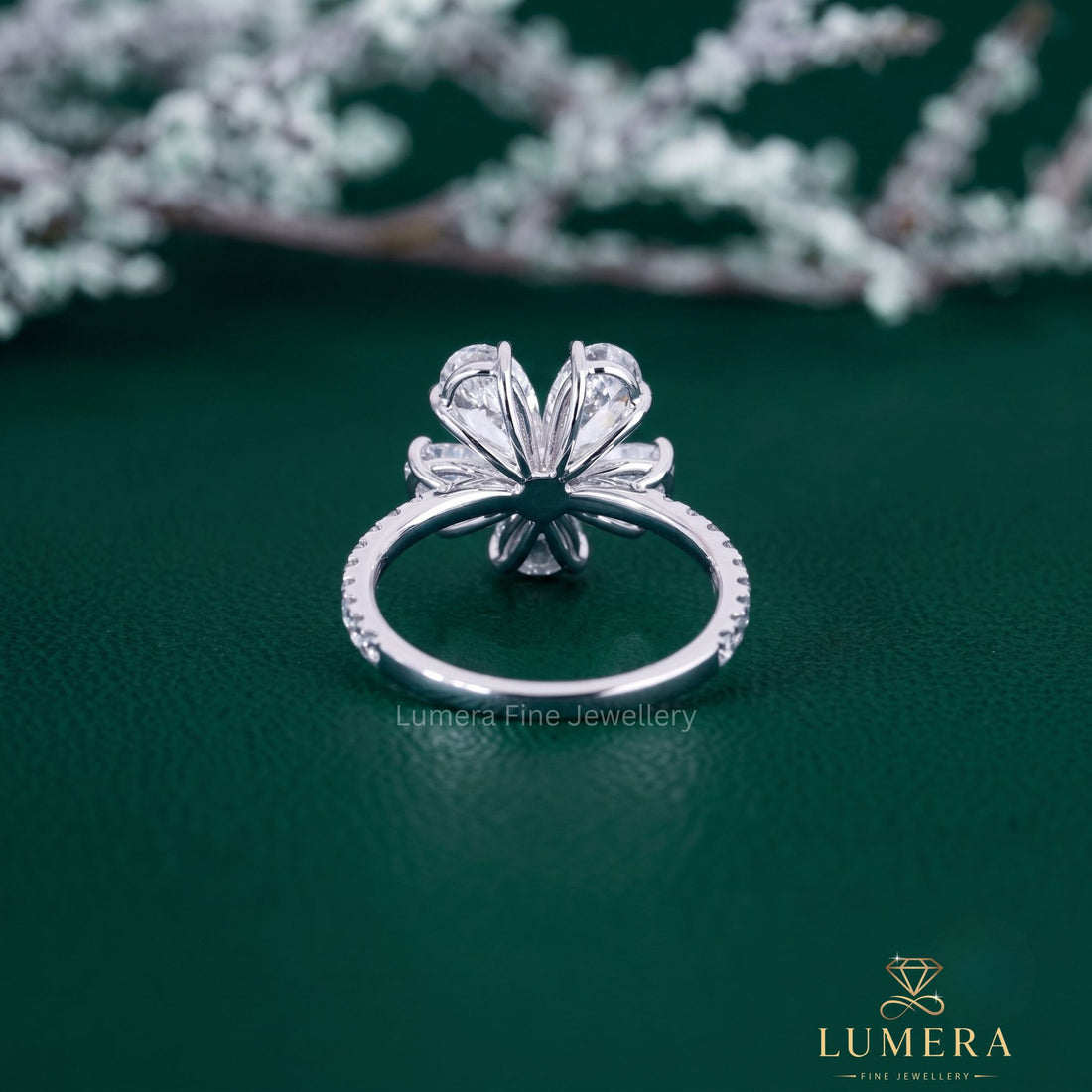 flower shape ring with pear shaped diamond ring.
