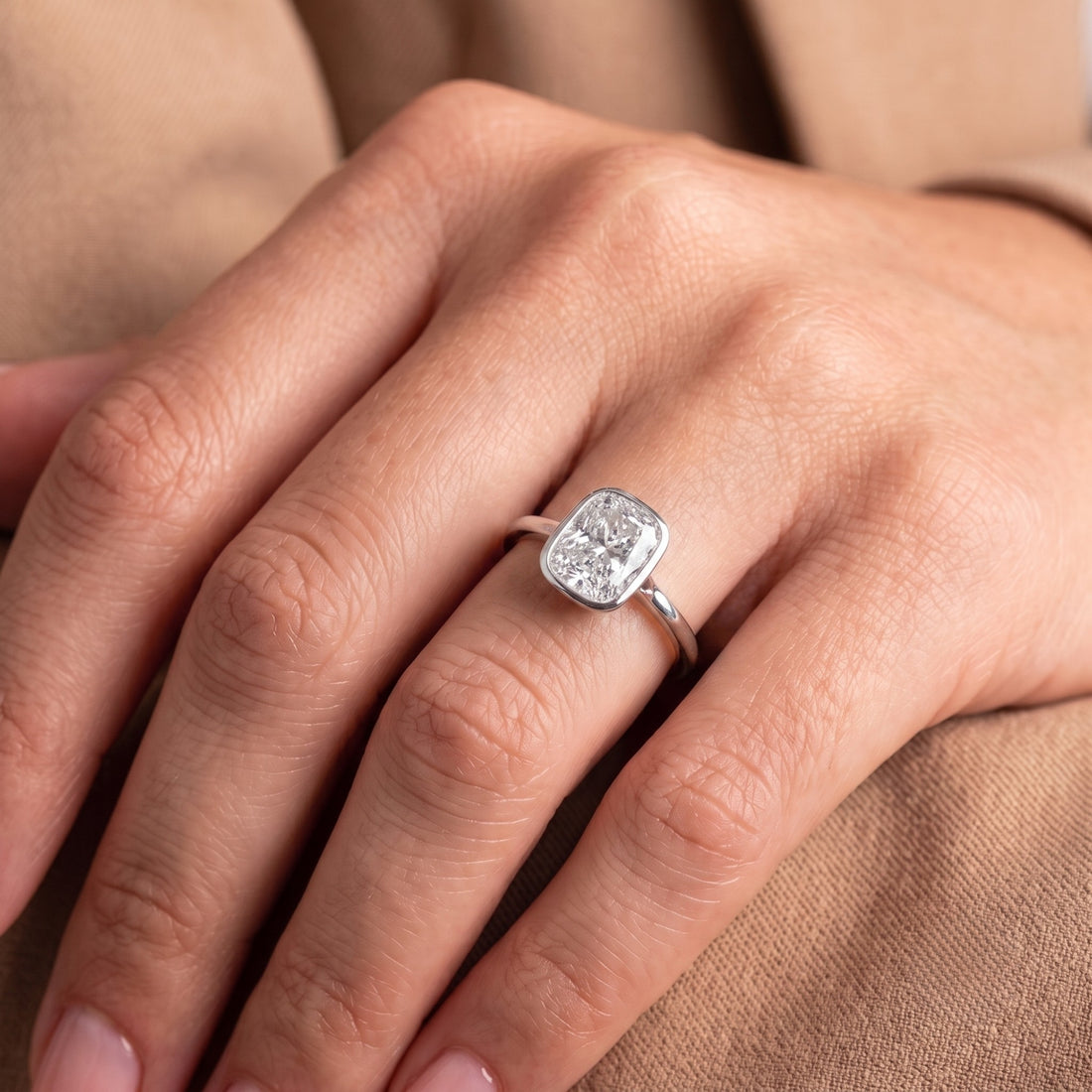 Cushion cut diamond ring with simple solitaire ring.
