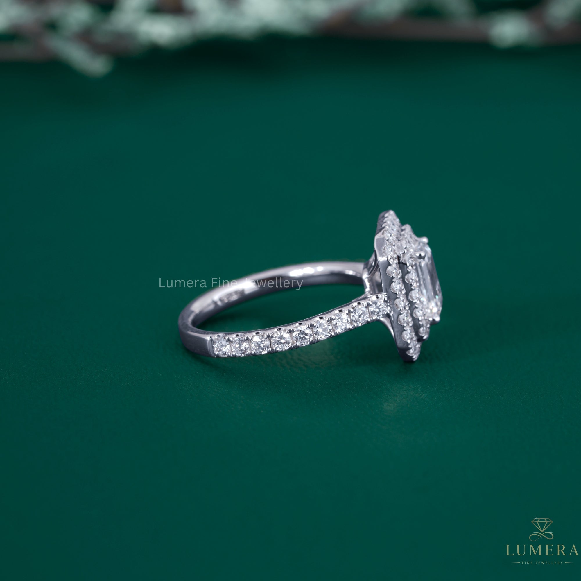 Emerald cut engagement ring with cathedral setting ring.
