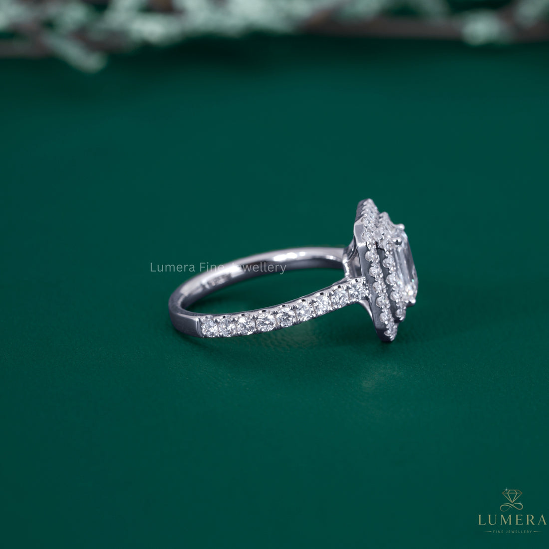 Emerald cut engagement ring with cathedral setting ring.