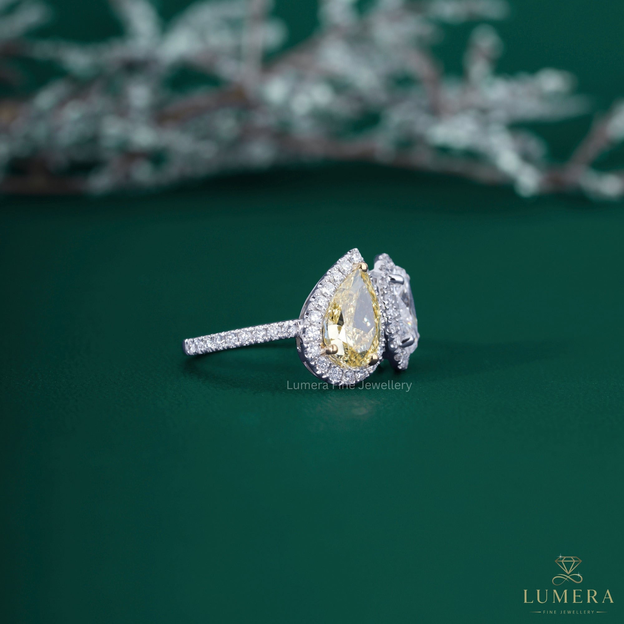 Yellow Pear Shaped Engagement Ring with yellow diamond engagement ring.