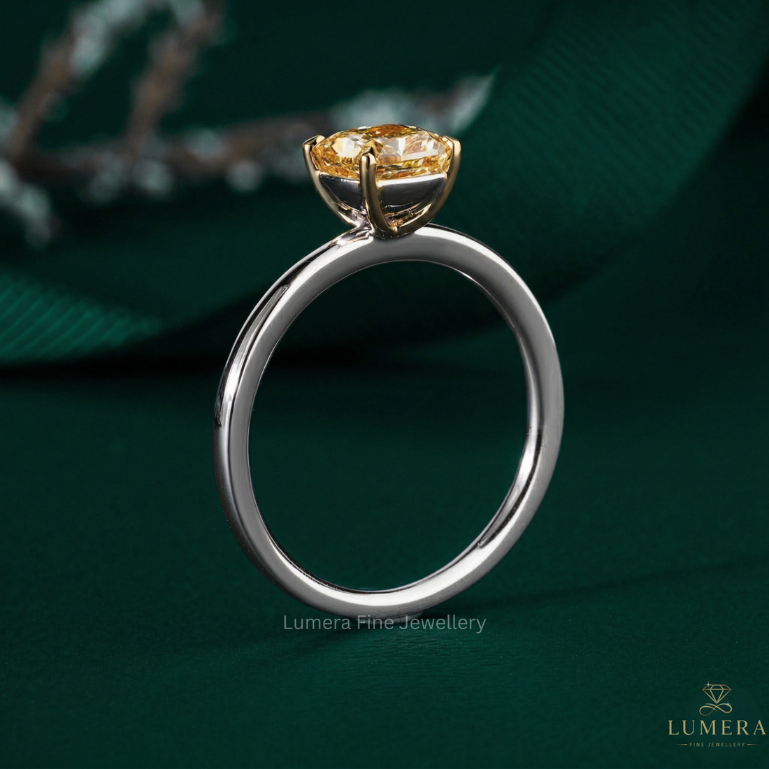 cushion cut engagement ring with claw prong setting.