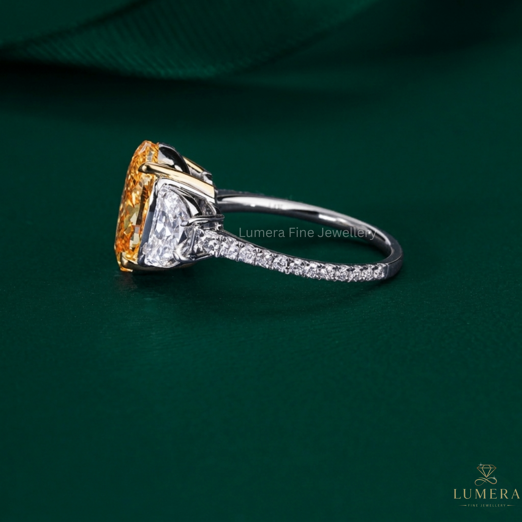oval diamond engagement ring on yellow oval cut ring.
