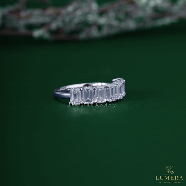 Emerald diamond wedding band with emerald cut eternity band.