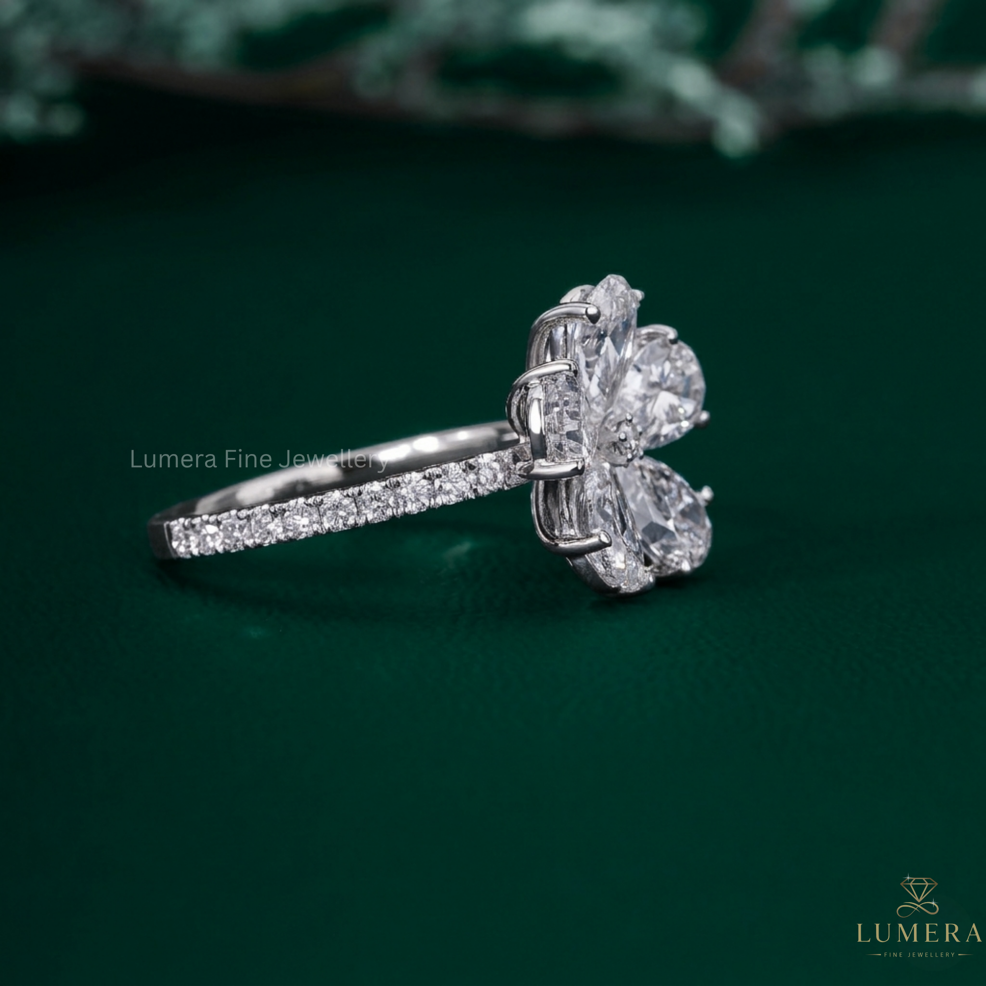 flower shape ring with pear shaped diamond ring.