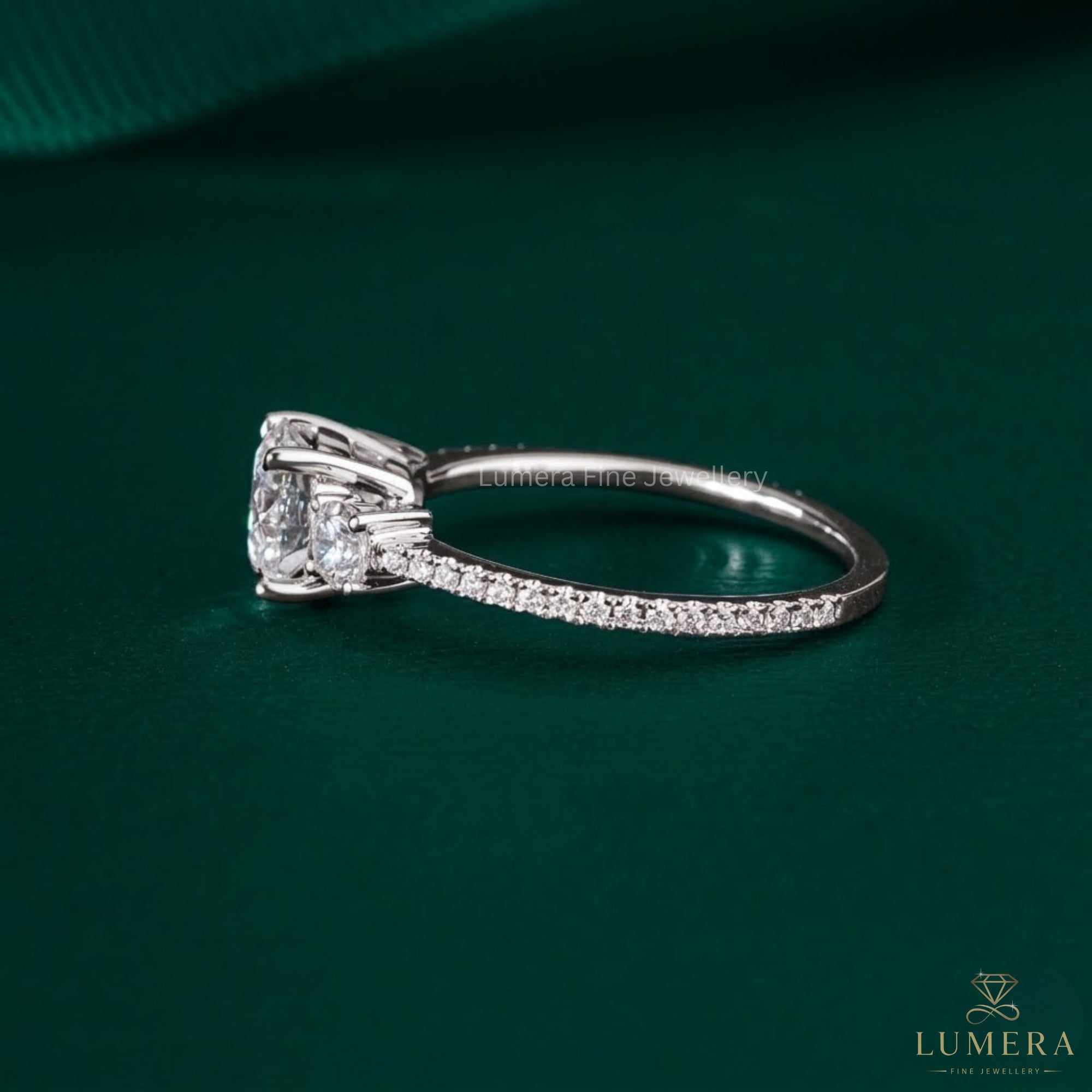 Three Stone Diamond Ring with cathedral setting ring.