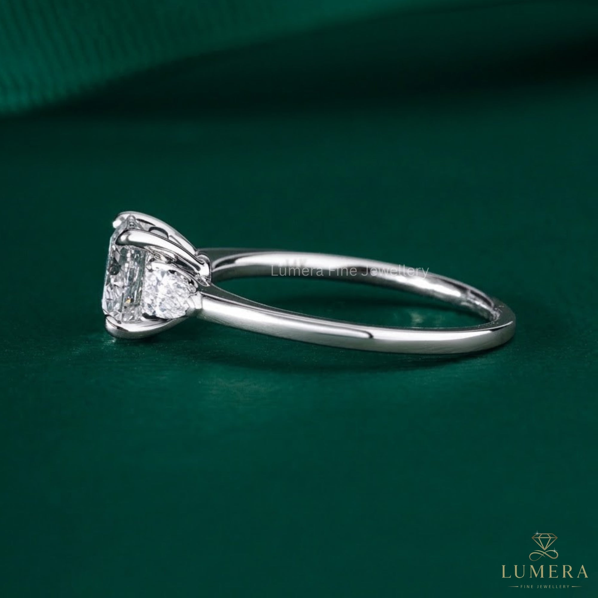 pear cut side stone on round and pear diamond ring.
