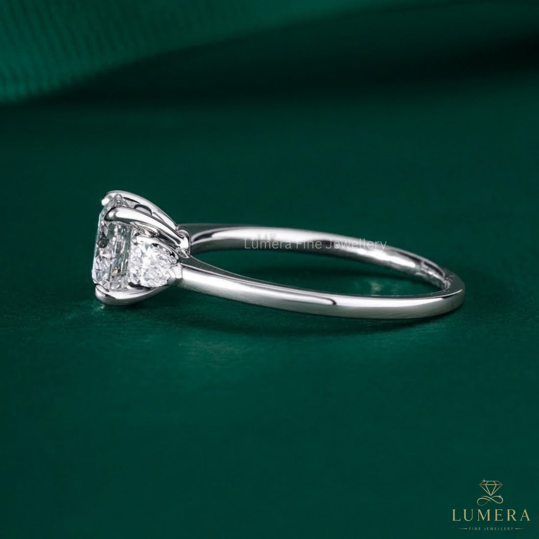 pear cut side stone on round and pear diamond ring.
