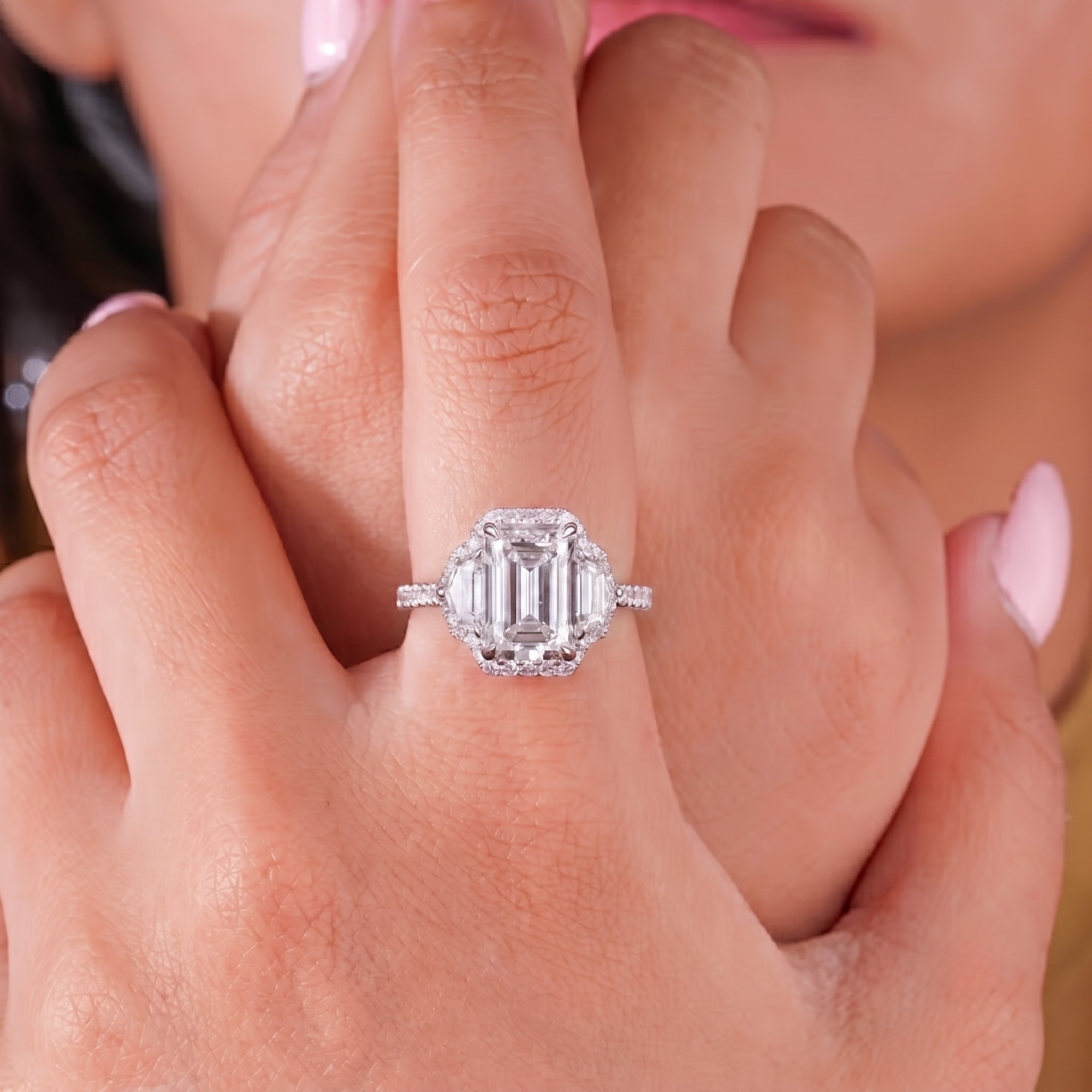 three stone engagement ring with trilogy ring.
