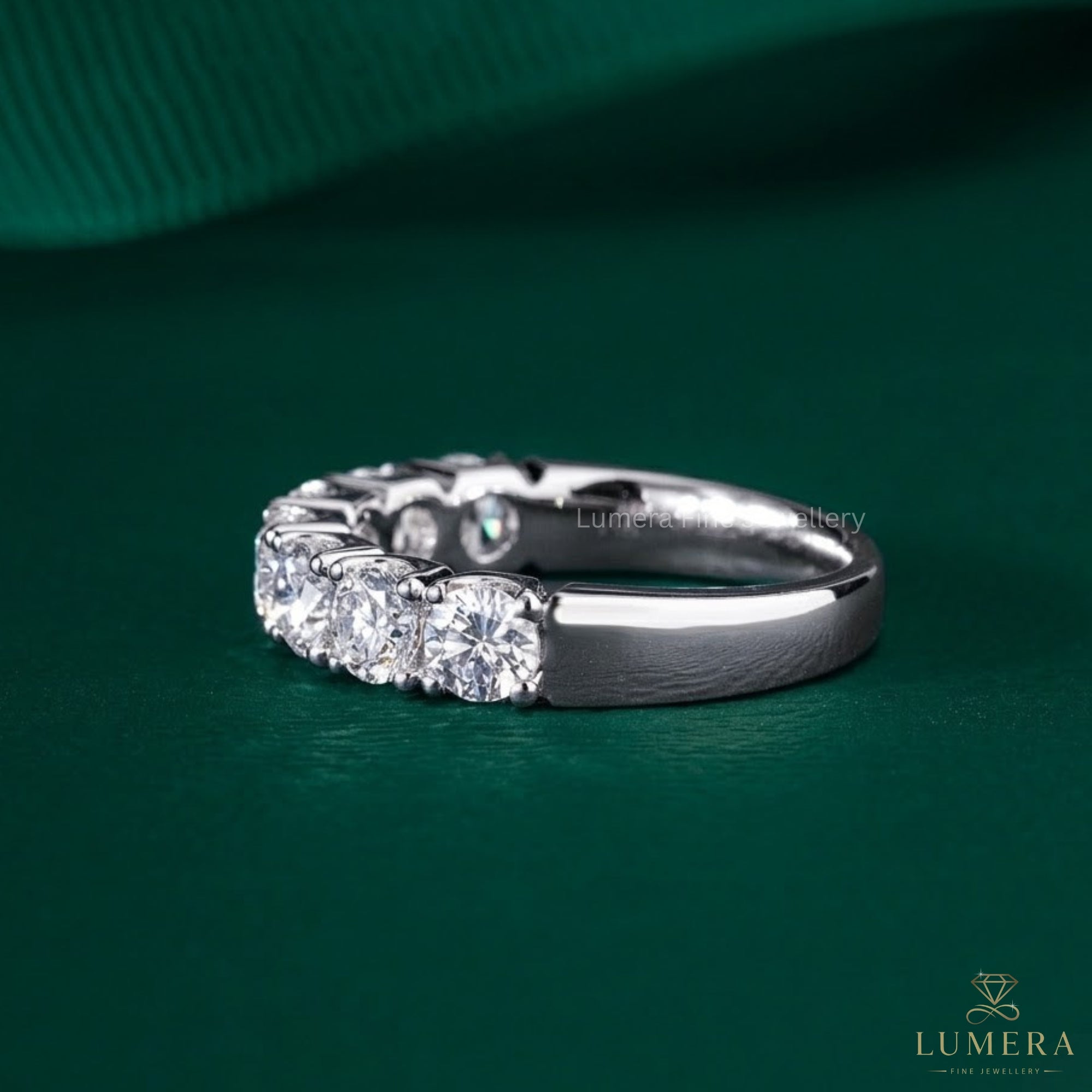 7 stone wedding band with shared prong setting.
