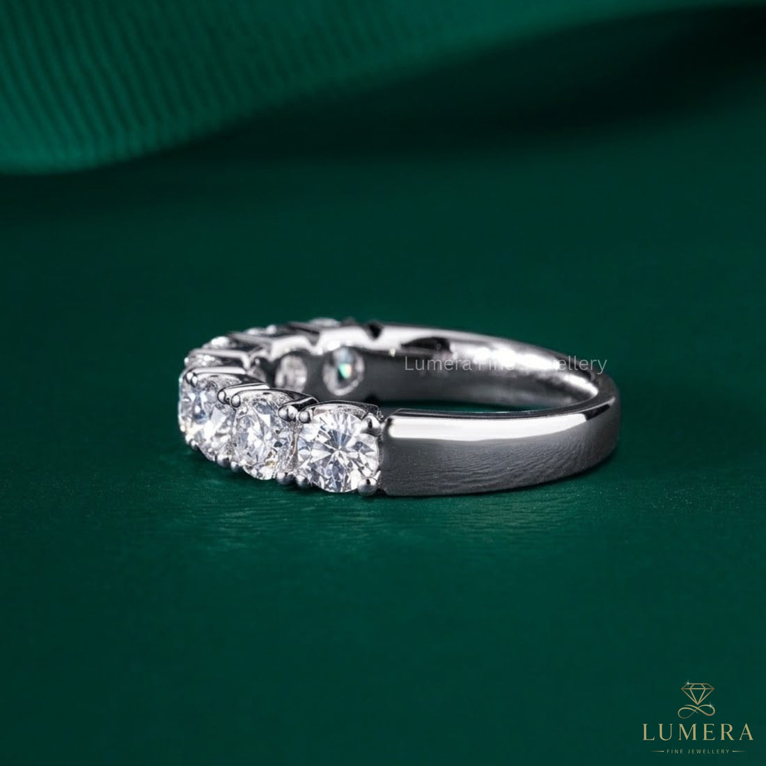 7 stone wedding band with shared prong setting.
