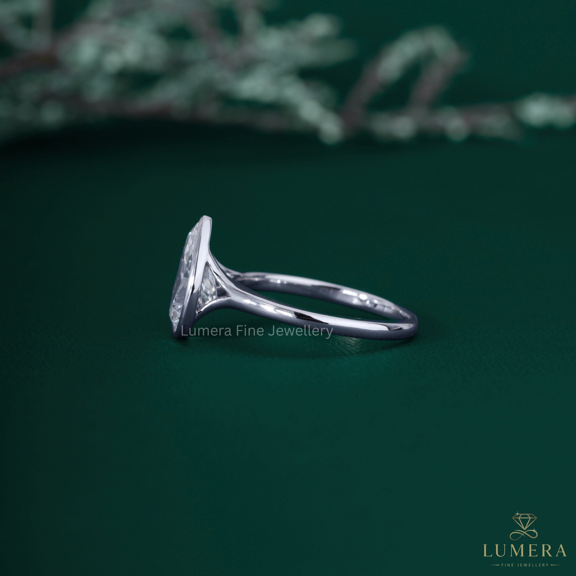 Pear cut engagement ring with pear diamond ring.