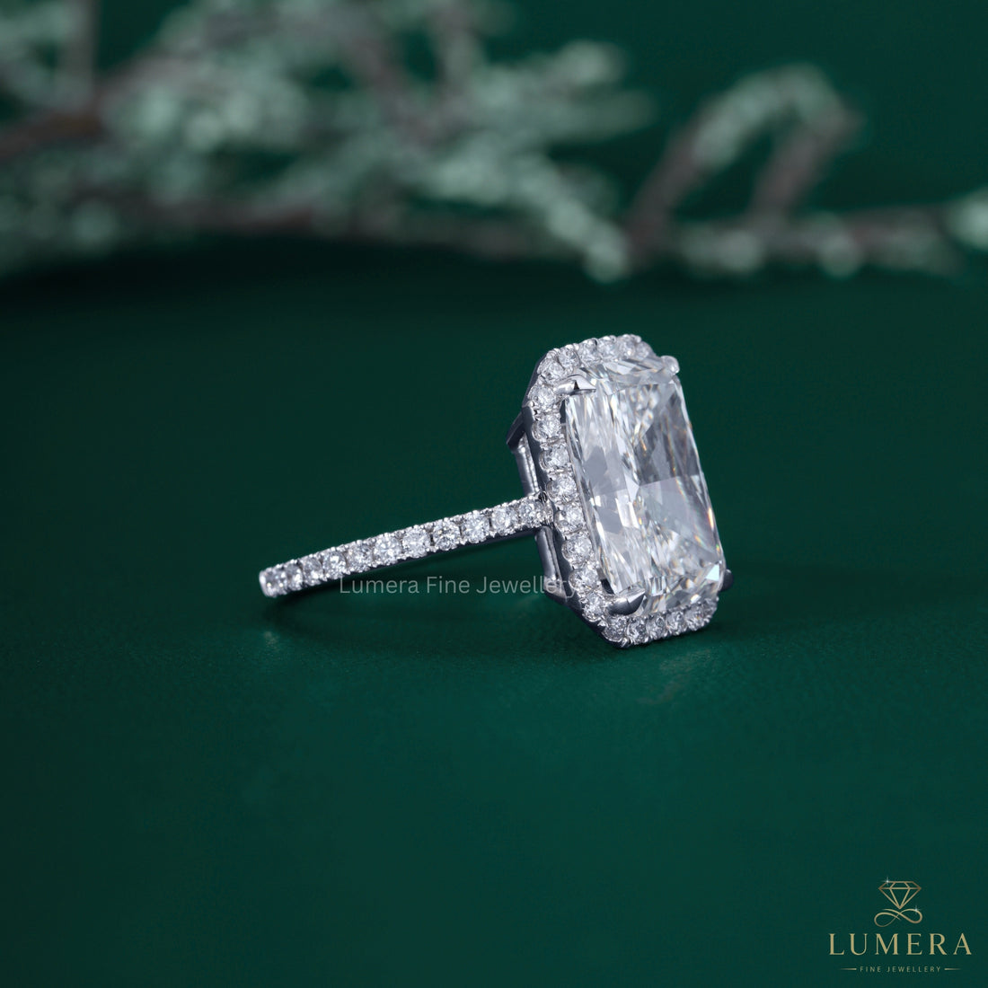Radiant diamond ring with radiant halo setting ring.