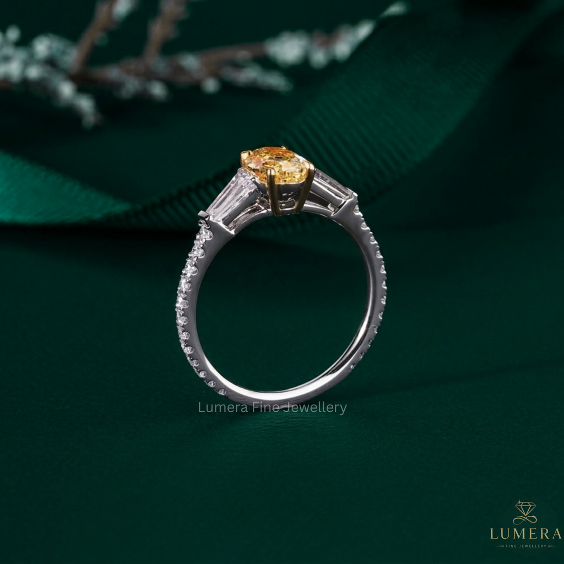 tapered baguette side stone with round cut pave band.