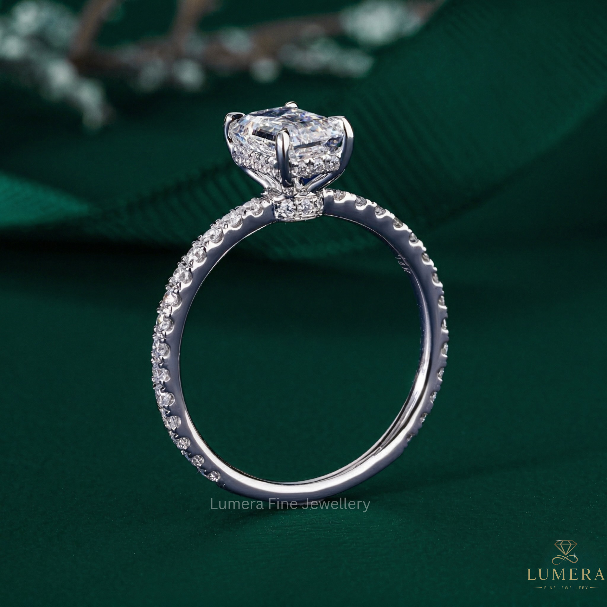 emerald cut engagement ring on double hidden halo ring.
