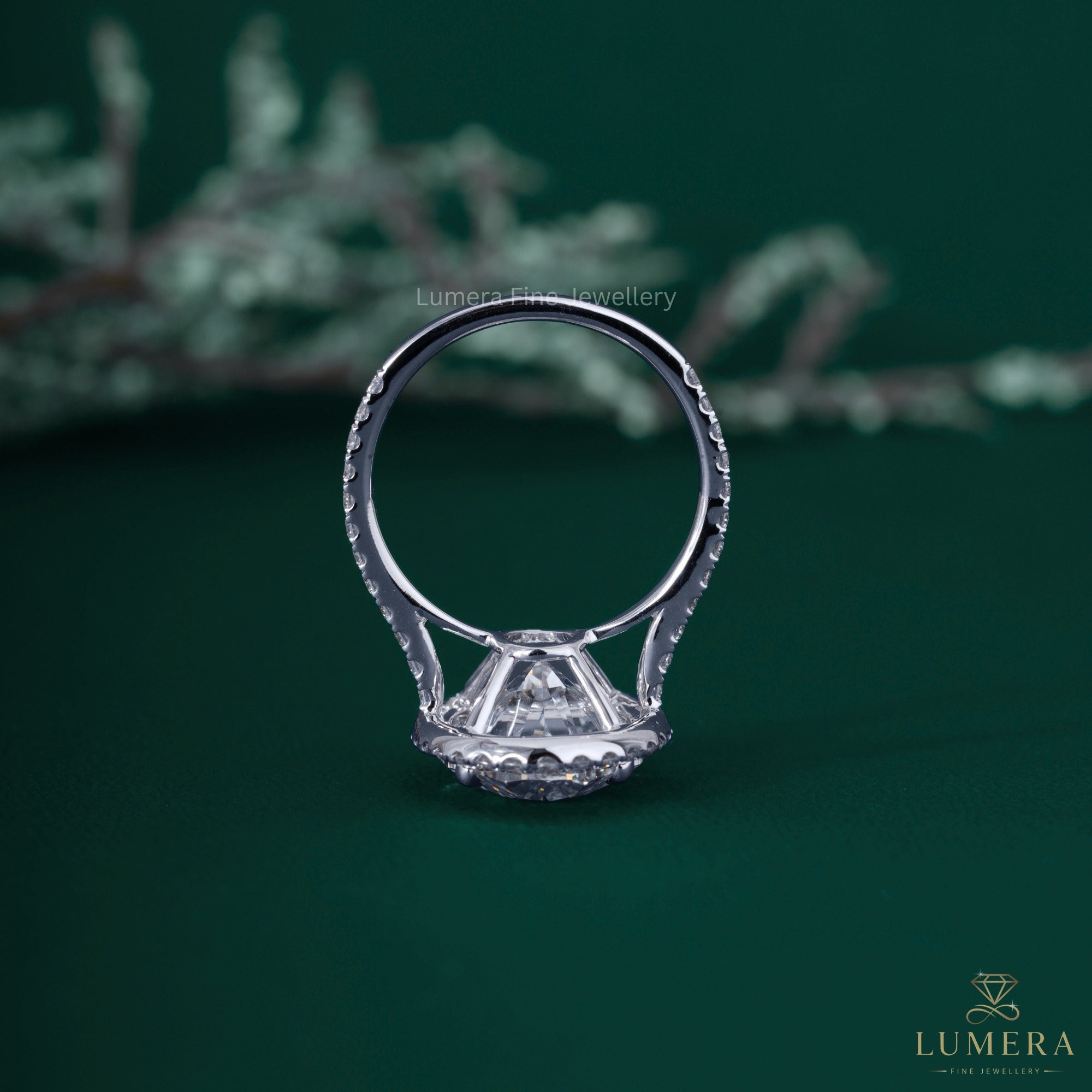Gold oval engagement ring with lab grown oval engagement ring.
