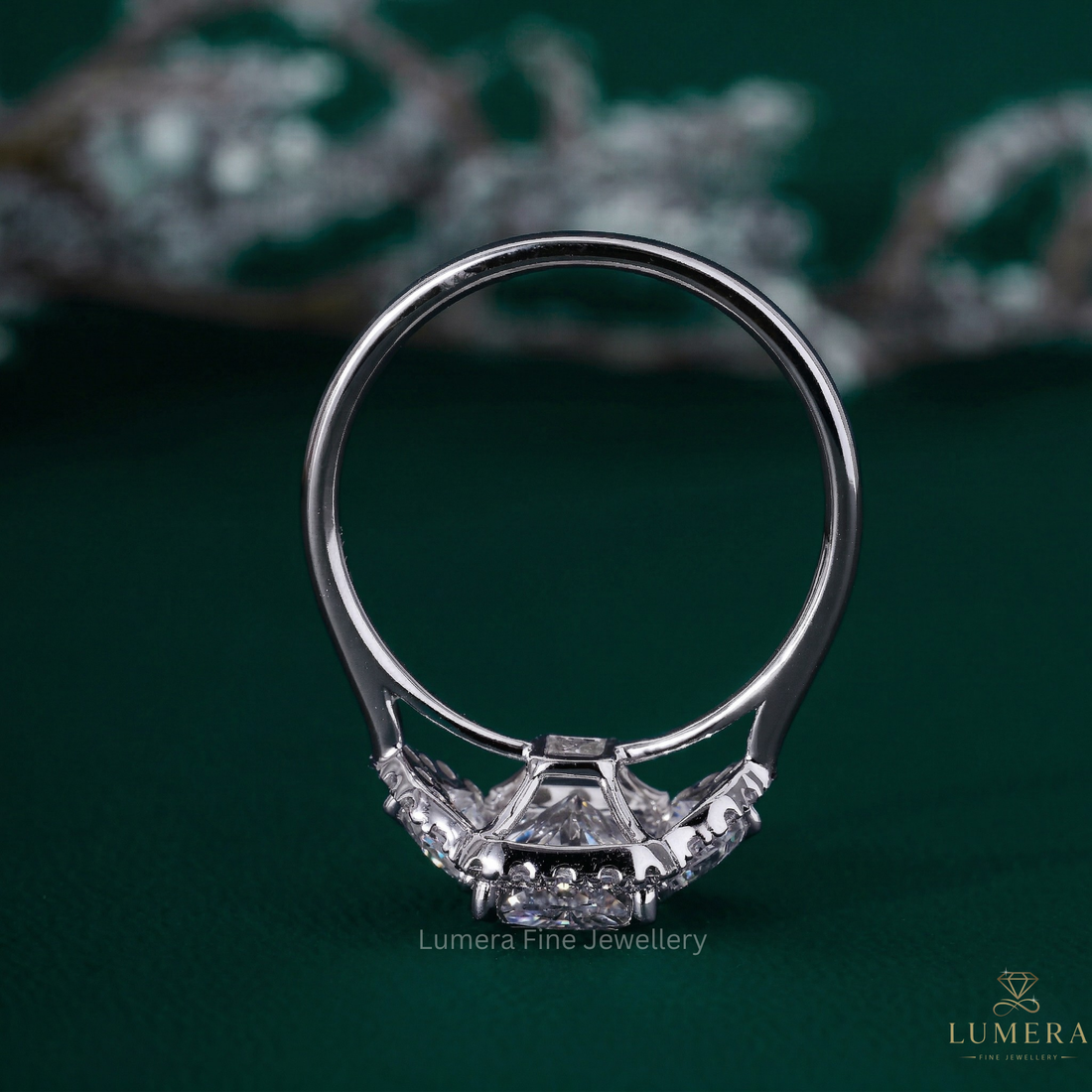 radiant diamond ring with Cadillac side stone.