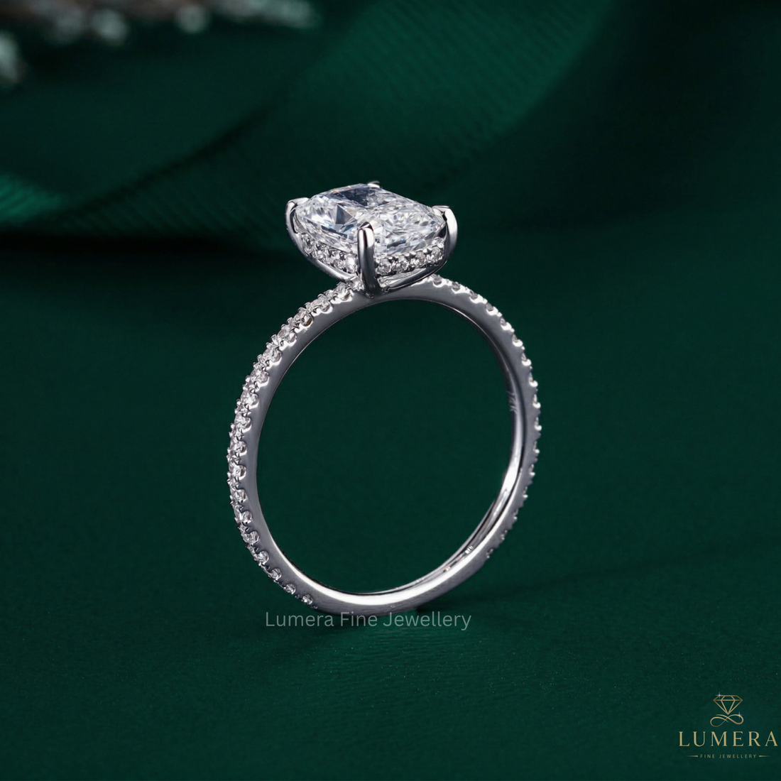elongated cushion engagement ring with 4 claw prong setting.