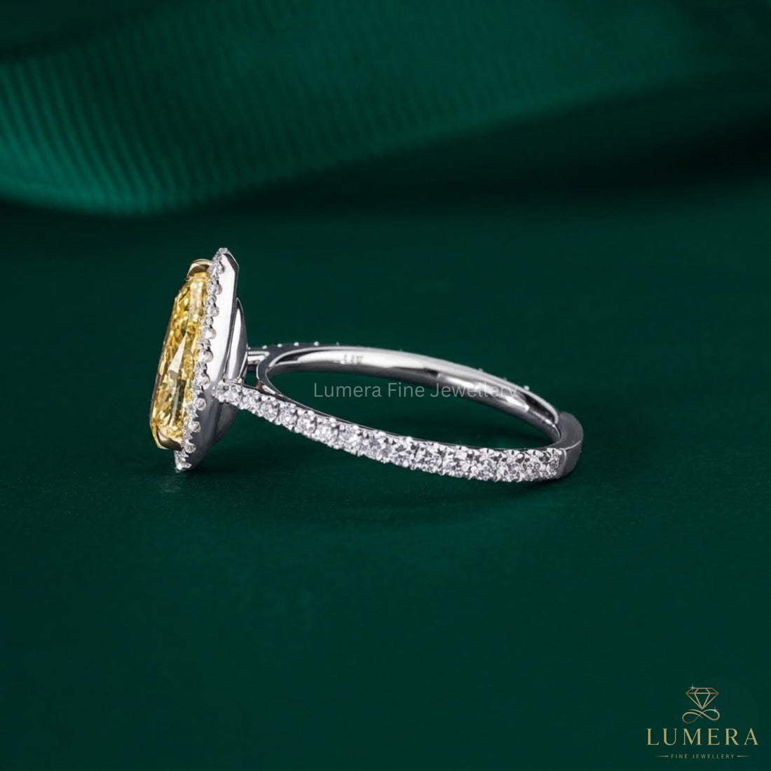 pear diamond engagement ring with cathedral setting engagement ring.