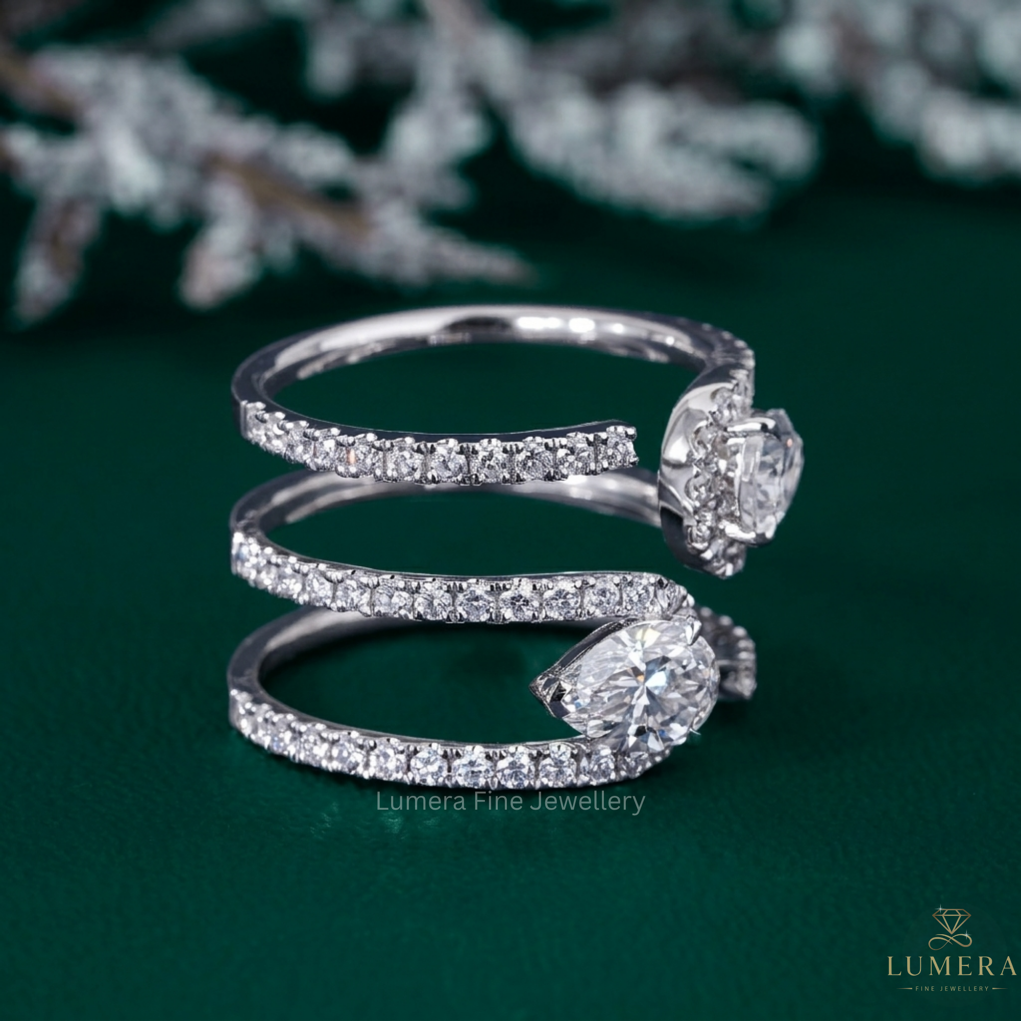 pear diamond band with two stone ring.
