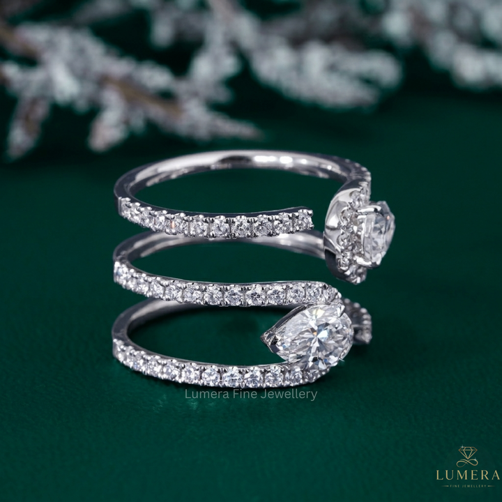 pear diamond band with two stone ring.
