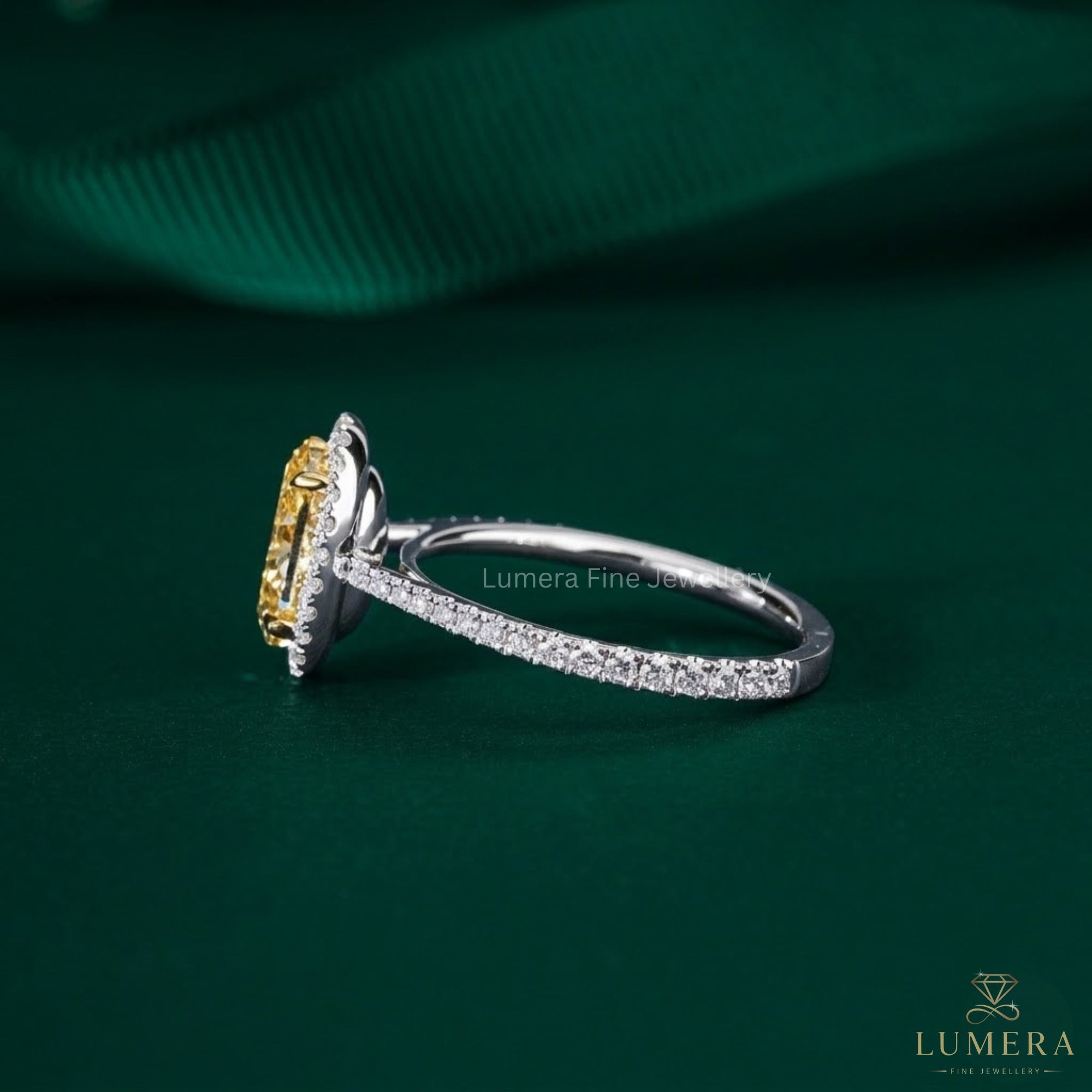 yellow oval diamond ring with two tone ring.