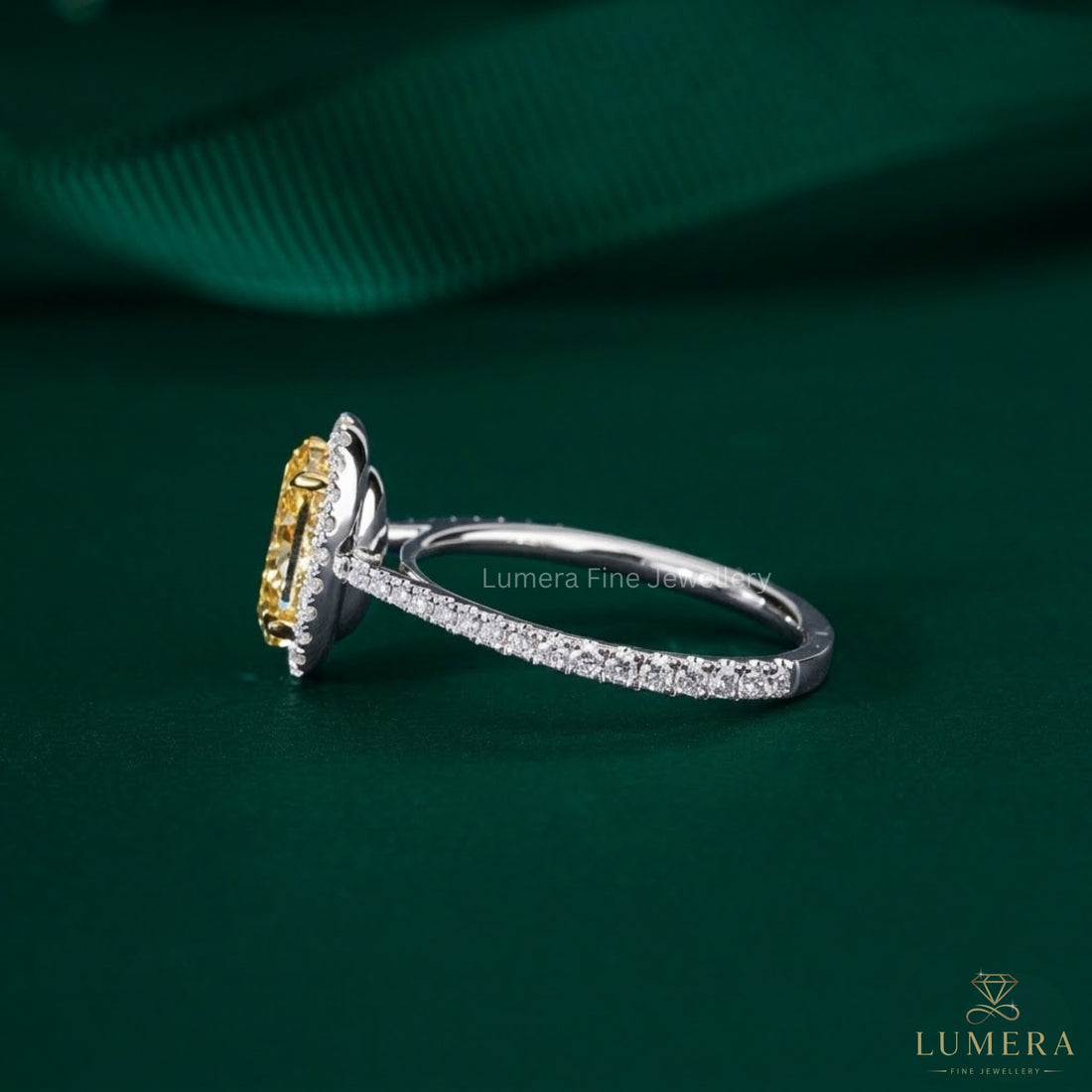 yellow oval diamond ring with two tone ring.