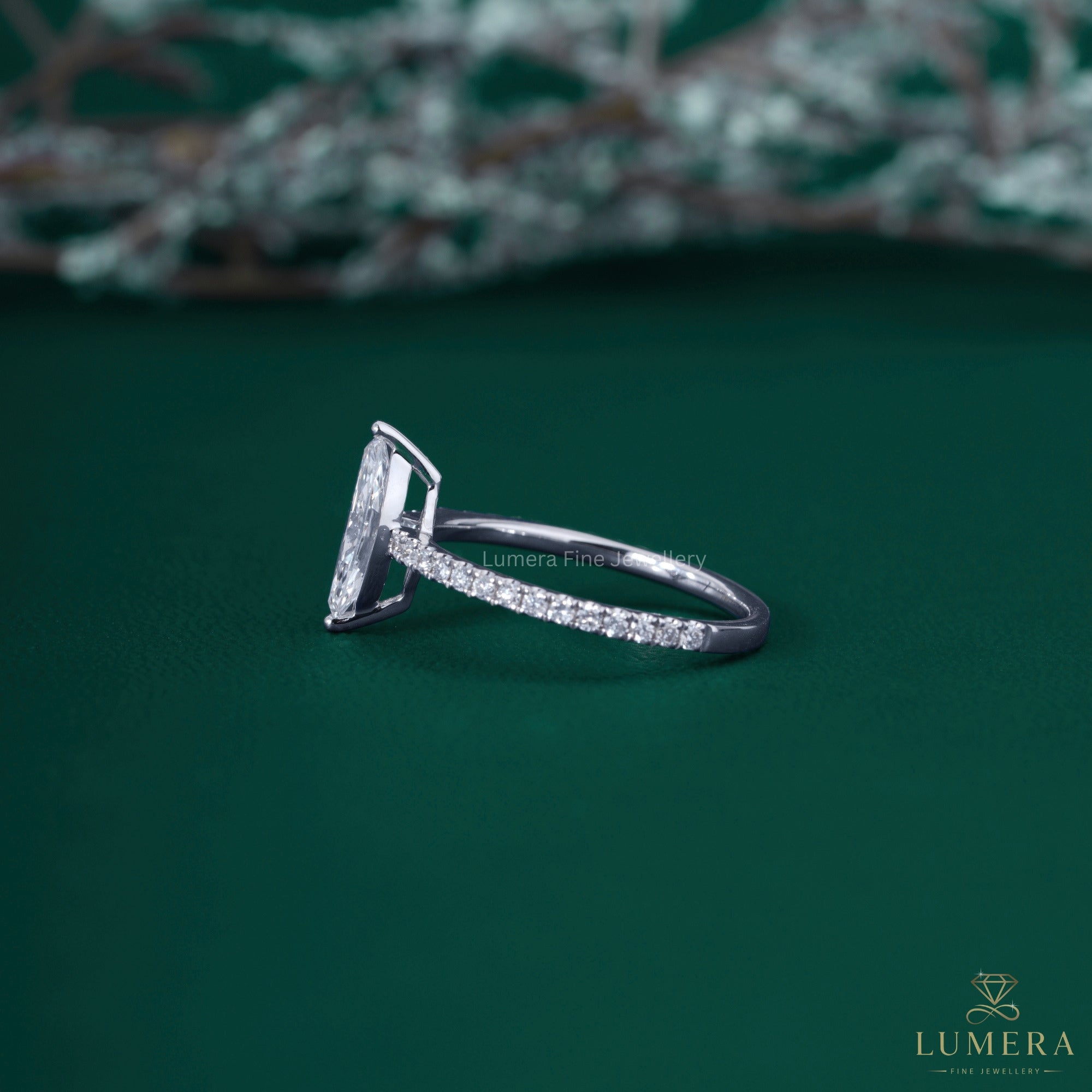 Marquise ring with pave ring setting.