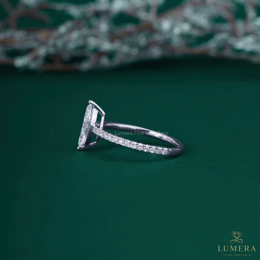 Marquise ring with pave ring setting.