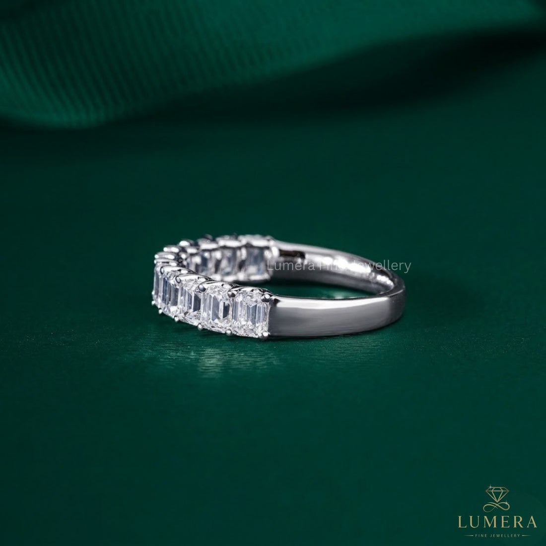 Emerald cut wedding band paired with a solid gold band.
