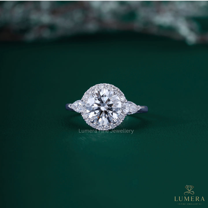 3 stone ring with pear side stone.