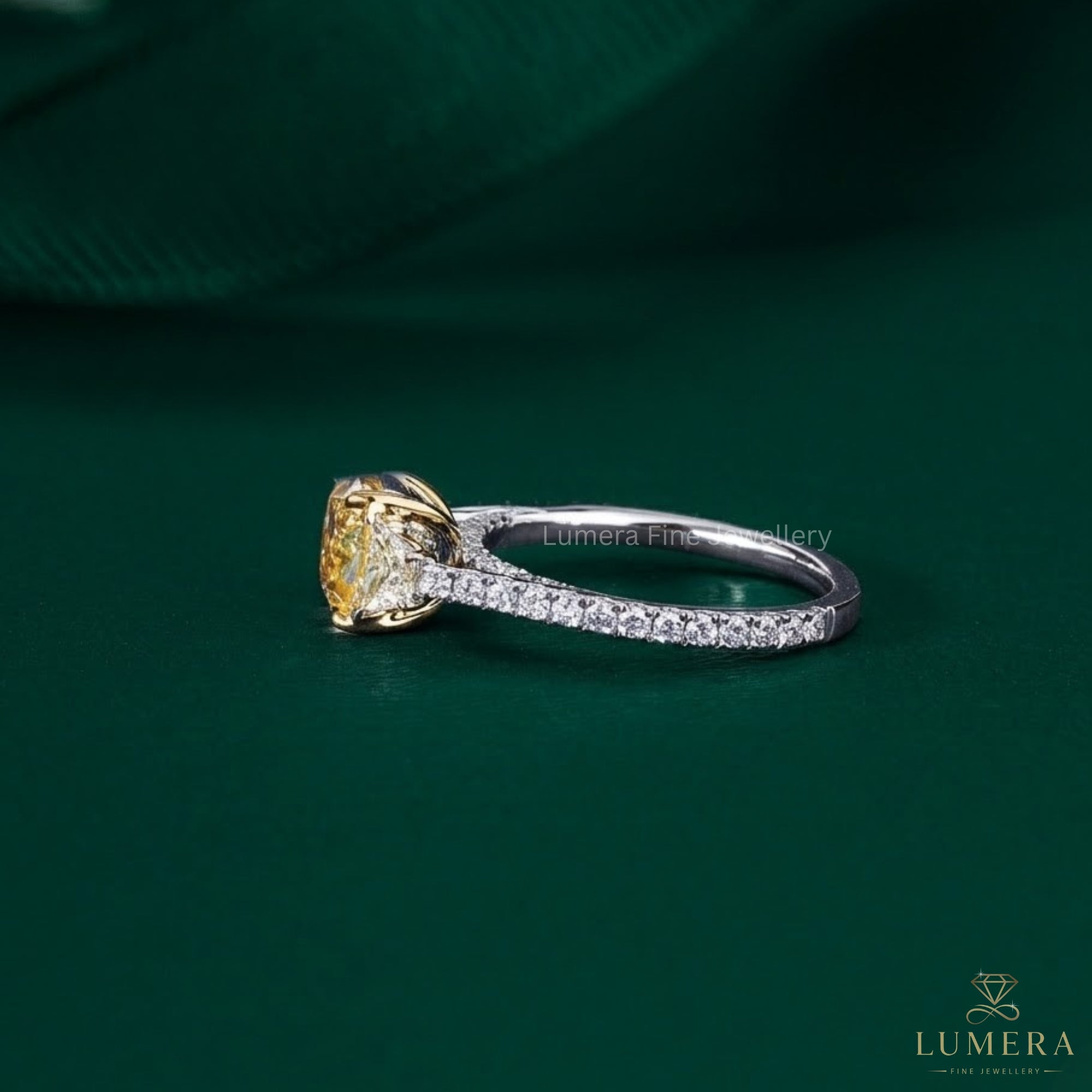 cushion cut engagement ring with bridge accent setting.