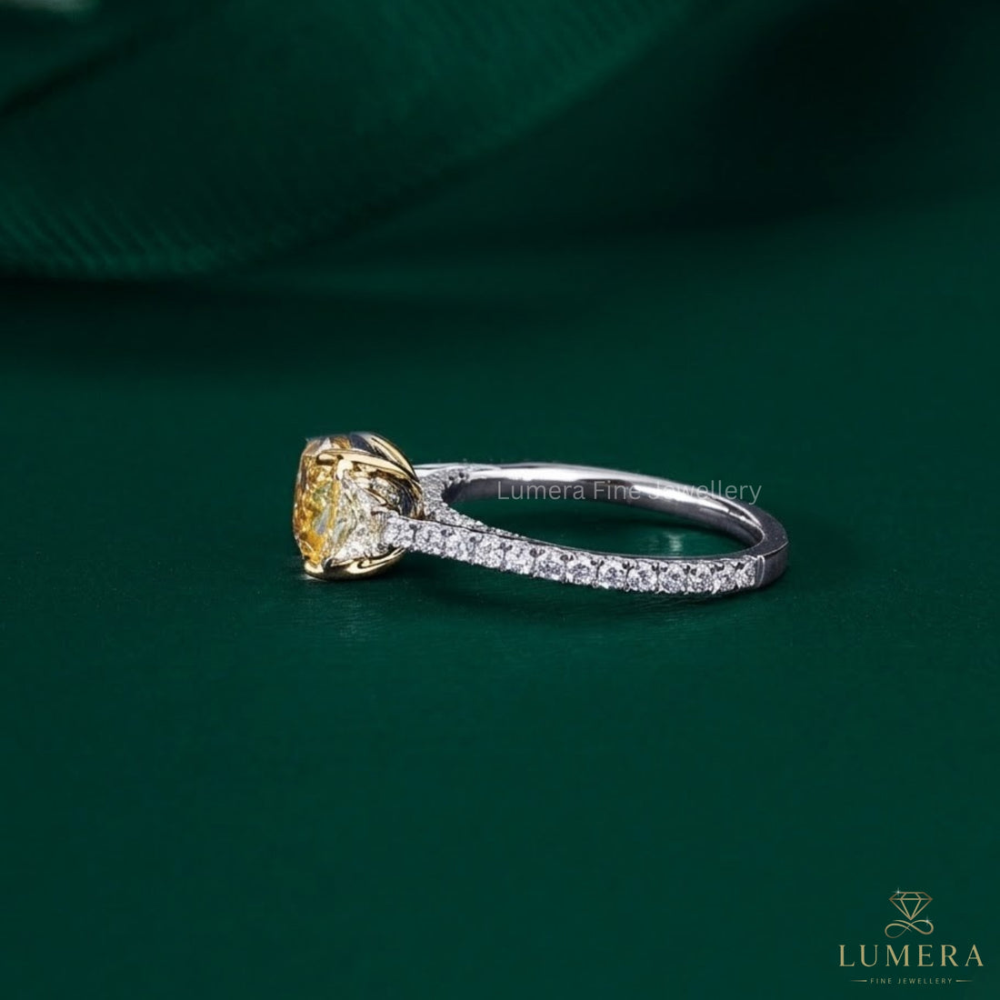 cushion cut engagement ring with bridge accent setting.