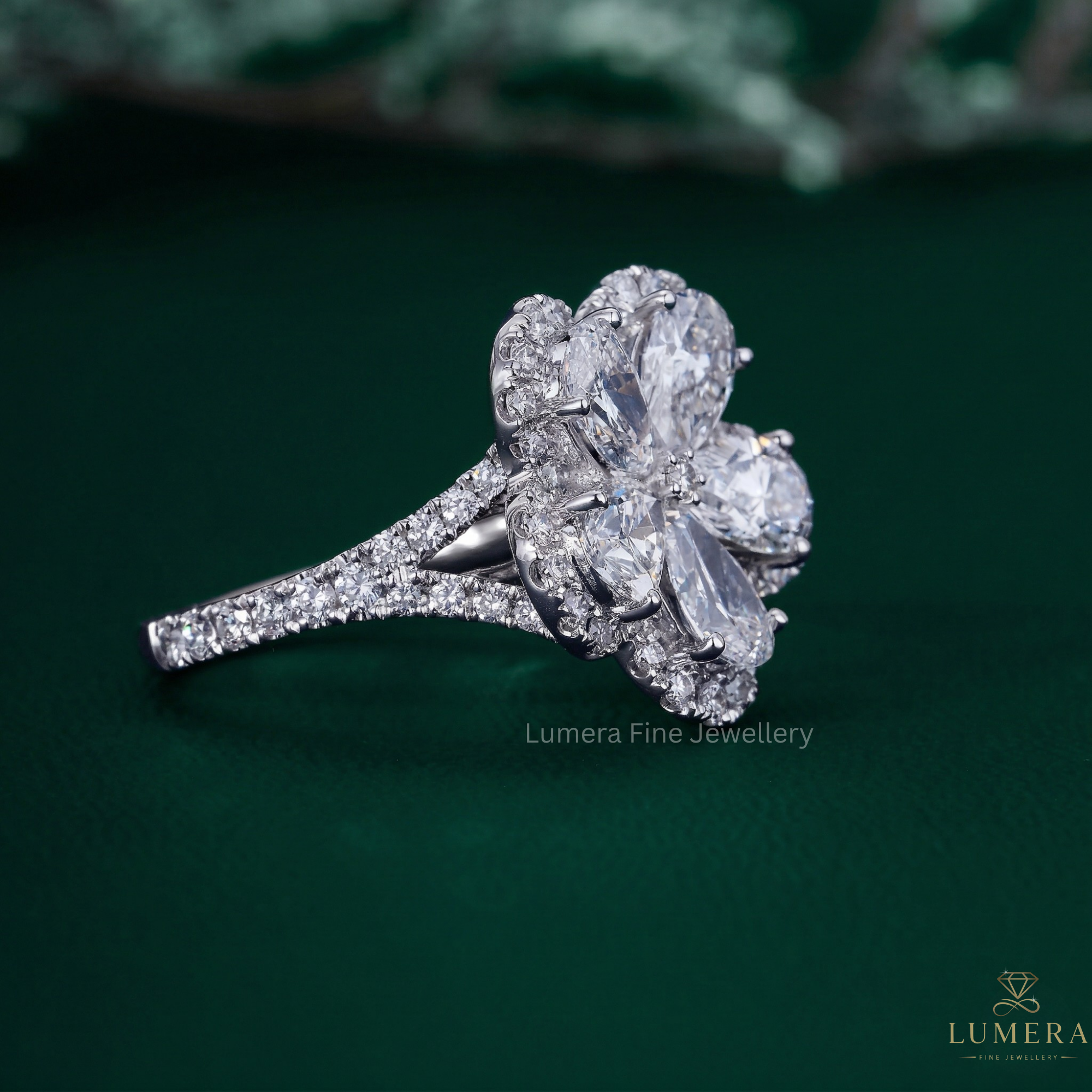 flower shaped diamond ring with pear engagement ring.