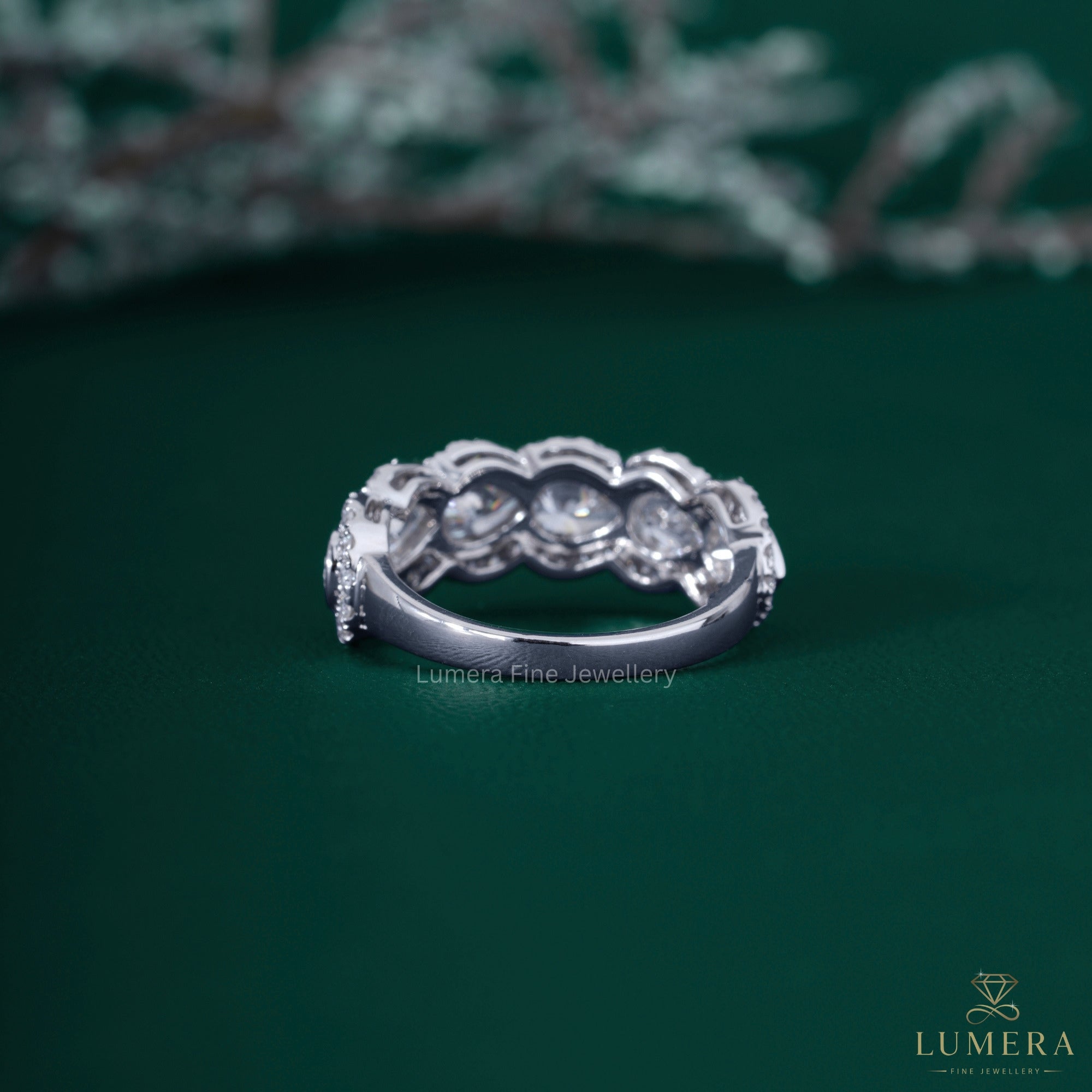 Almond diamond wedding band with six stone band.