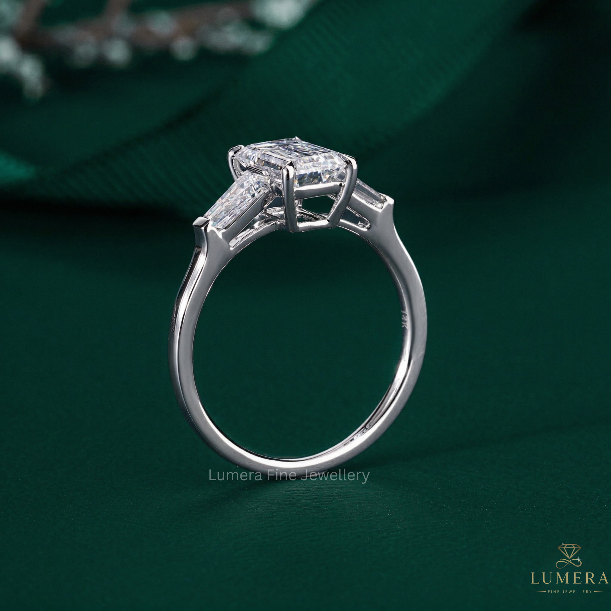 tapered baguette side stones with three stone diamond ring.
