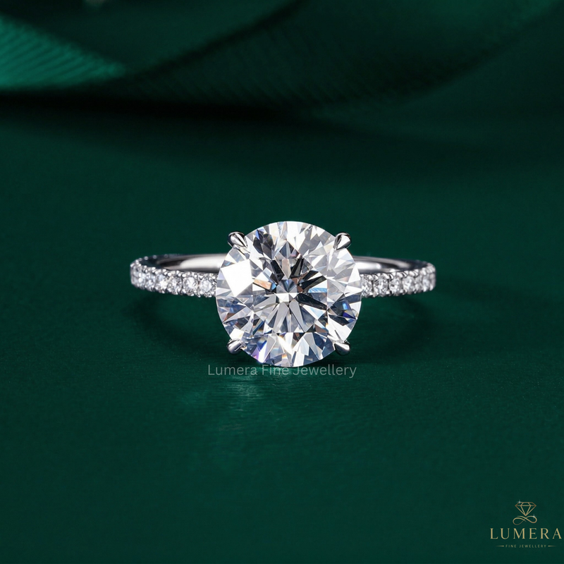 Round cut hidden halo ring with round cut engagement ring.