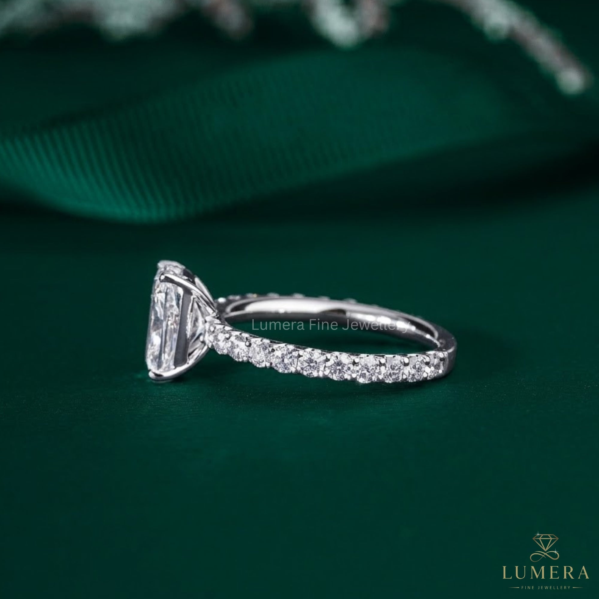 cushion cut diamond ring in pave setting band style.
