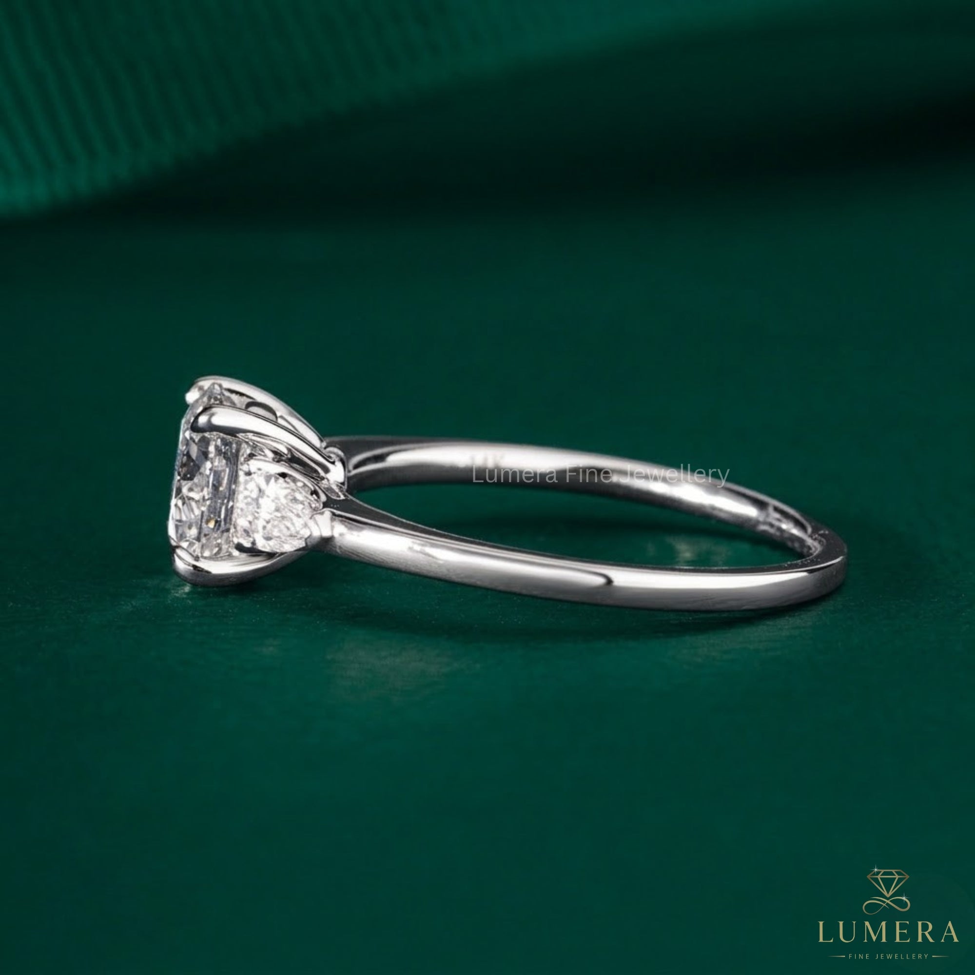 elongated cushion engagement ring with 4 claw prong setting.