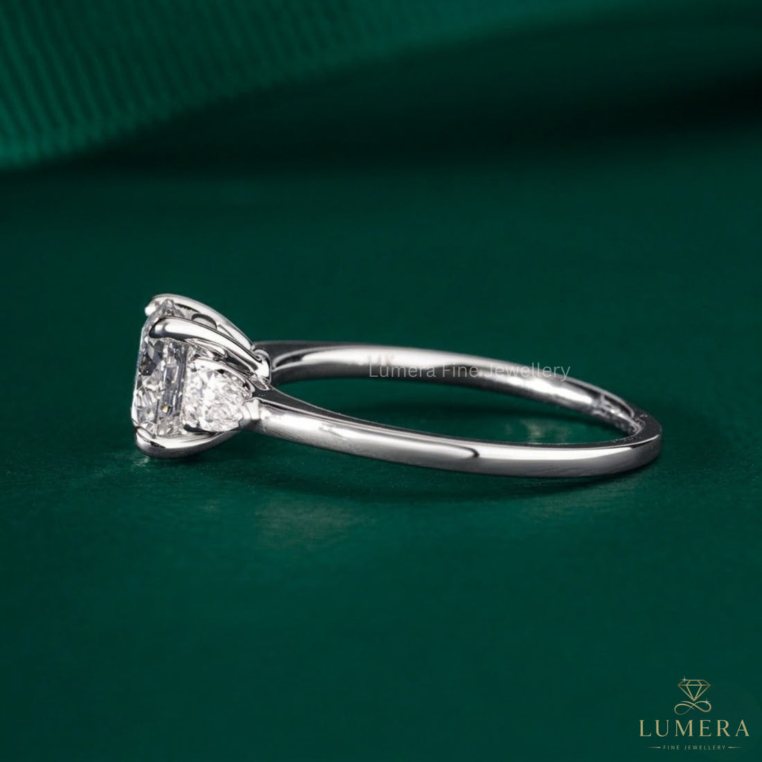 elongated cushion engagement ring with 4 claw prong setting.