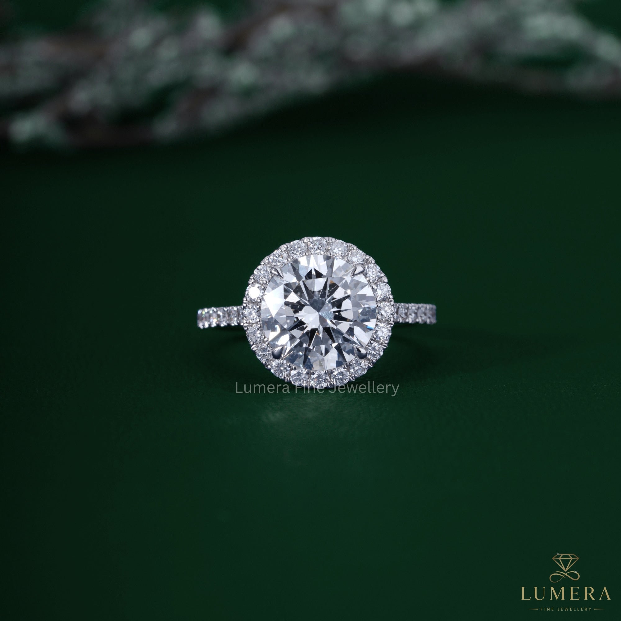 Round shaped engagement ring with cathedral setting ring.