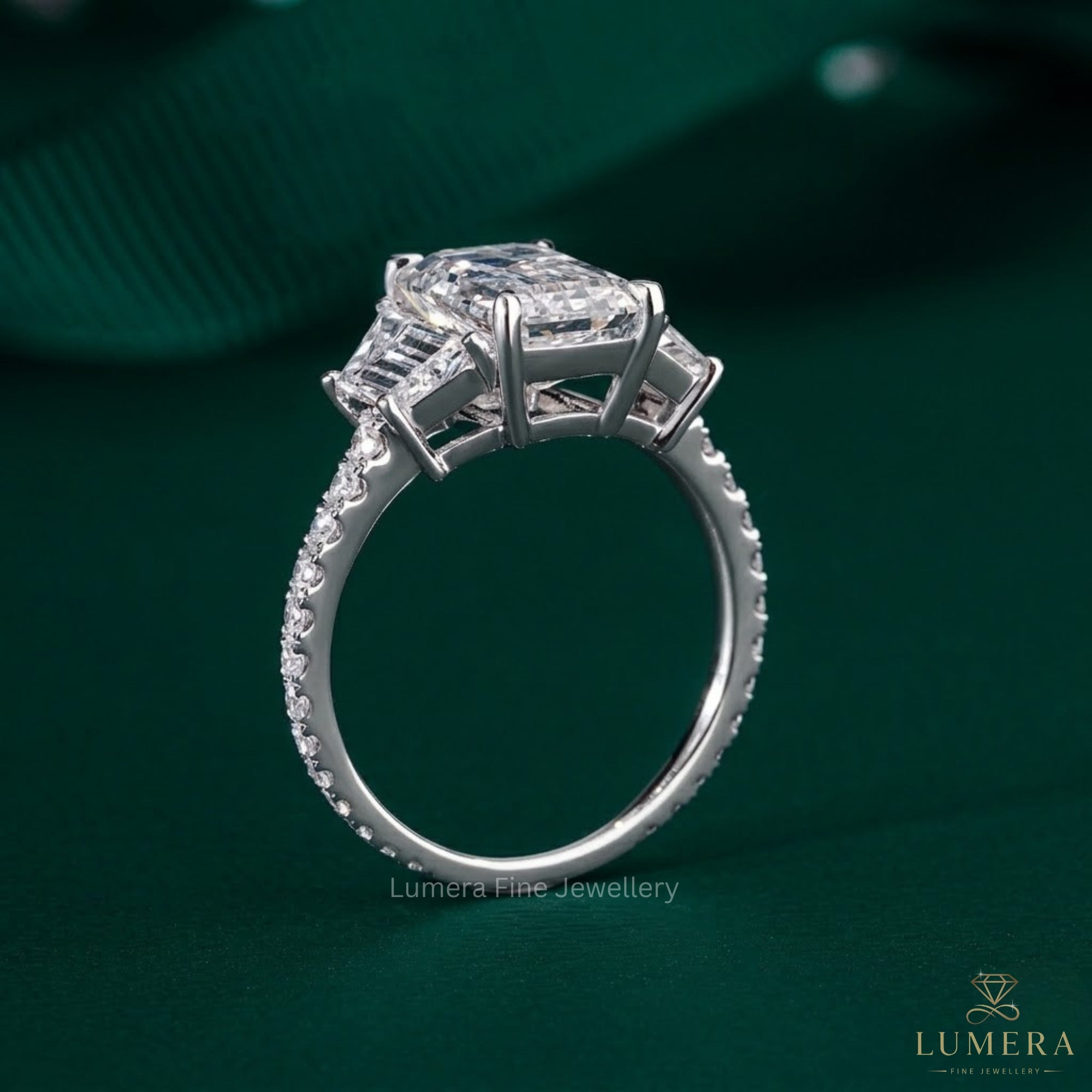 three stone ring with trapezoid side stones.