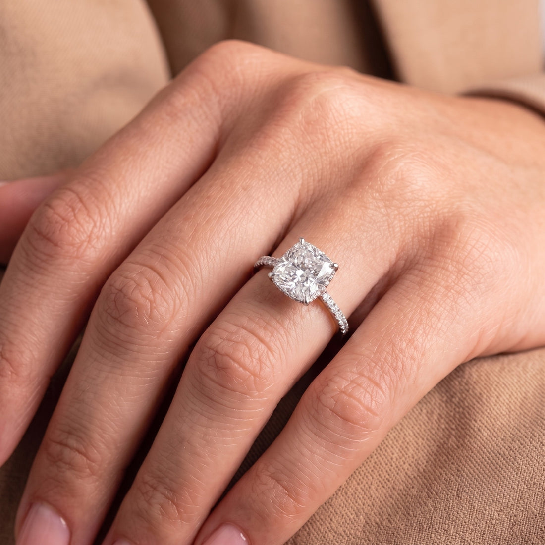 cushion engagement ring with pave diamond ring.
