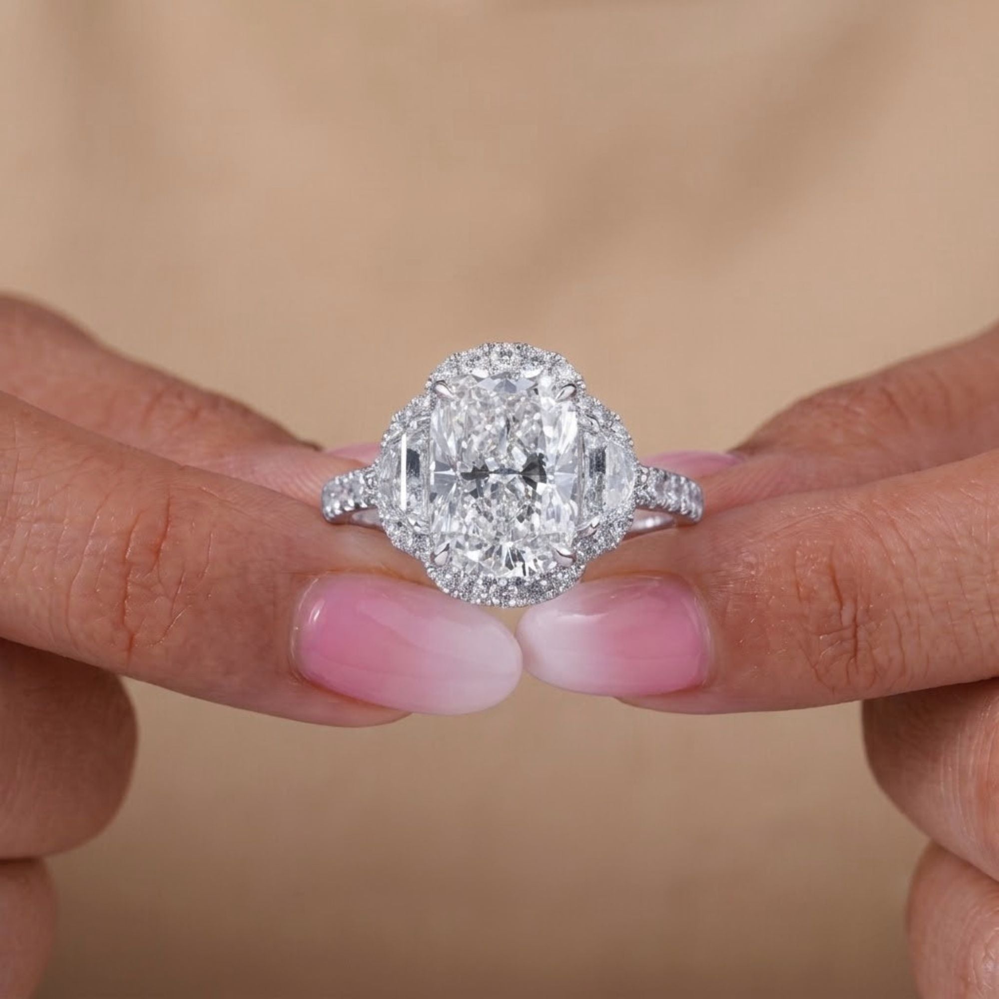 3 stone diamond ring with 4 claw prong setting.
