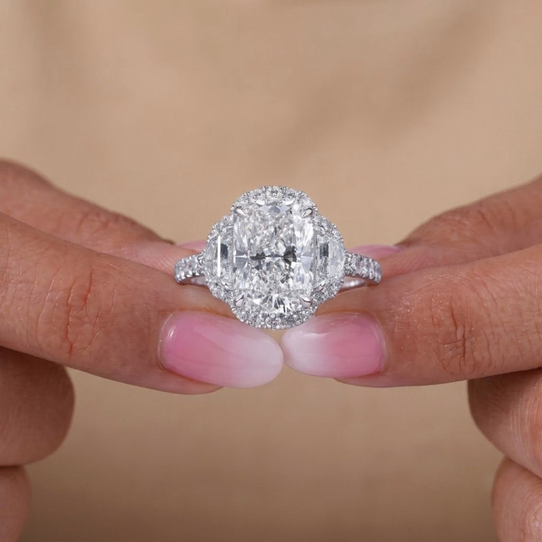 3 stone diamond ring with 4 claw prong setting.
